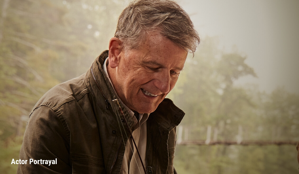 Campaign image of older gentleman smiling. Actor portrayal